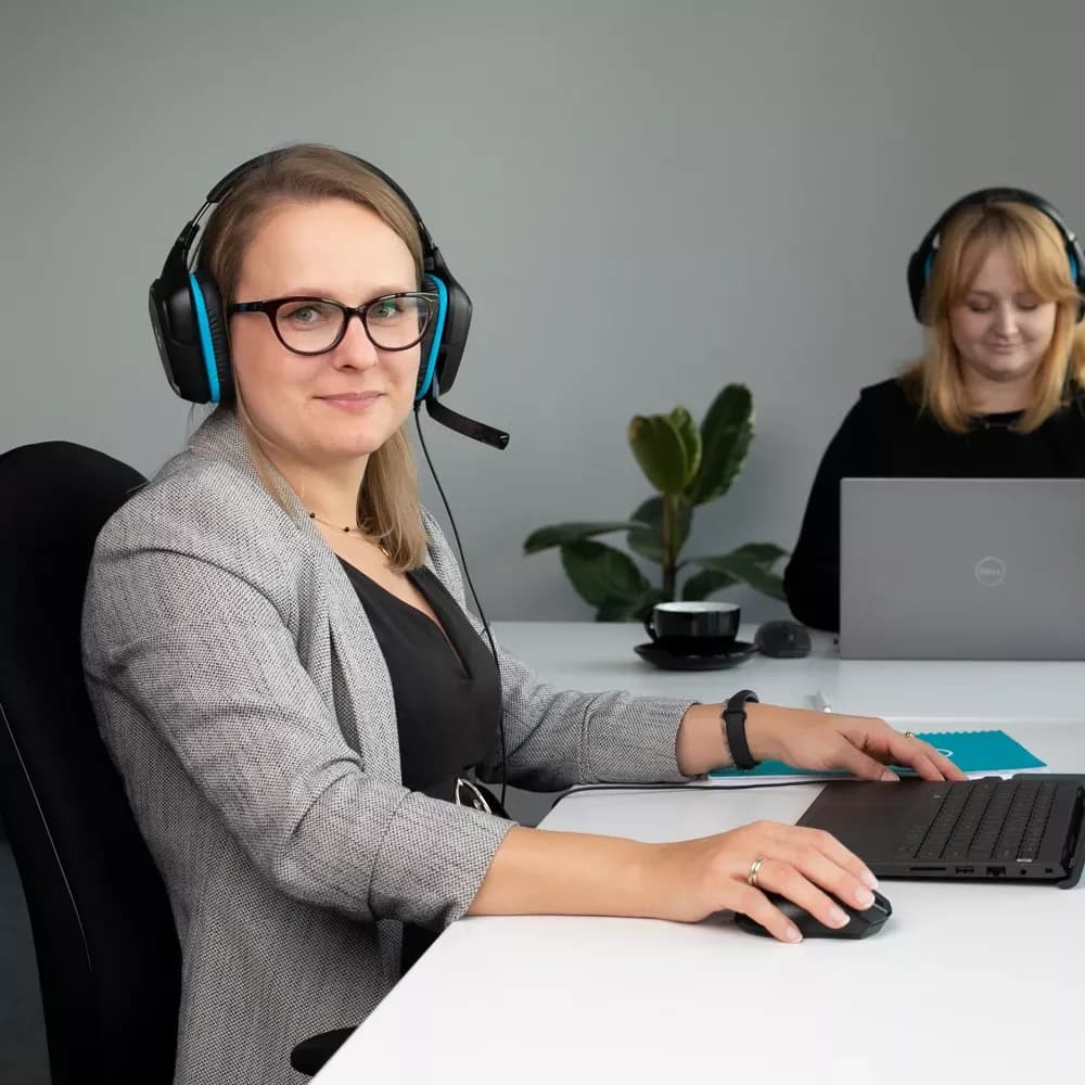 Two customer service agents working in office