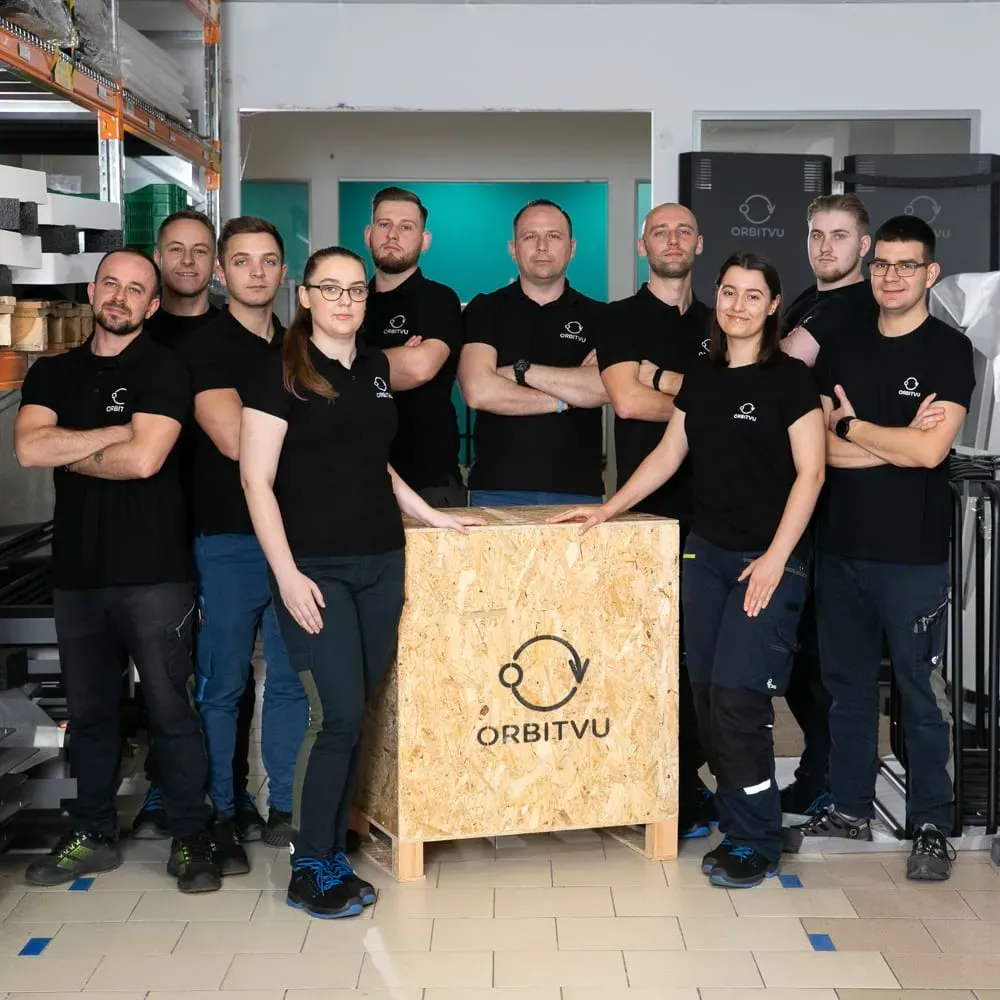 Orbitvu Production and Logistics Team Posing with Branded Wooden Crate